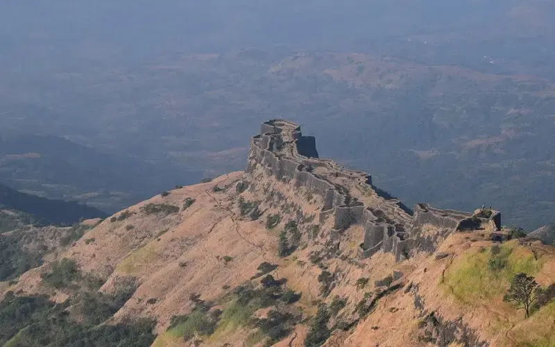 Maharashtra’s coastal beaches, historic forts, and urban skyline under clear skies.