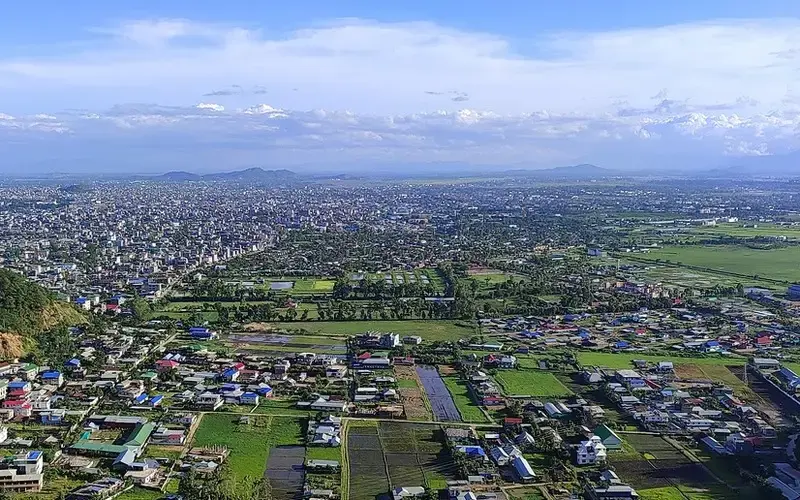 Scenic view of Manipur’s Loktak Lake with floating phumdis and surrounding green hills.